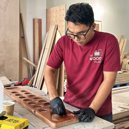 Crafting a foldable congkak board with Surian wood