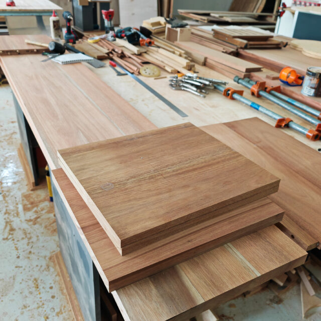 Melunak wood grain close-up showing natural dark tone before walnut stain